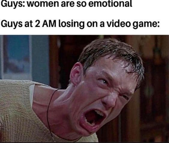 A man with a sweaty, furious expression, mouth wide open in a scream, wearing a beige sweater and a thin necklace. The image…