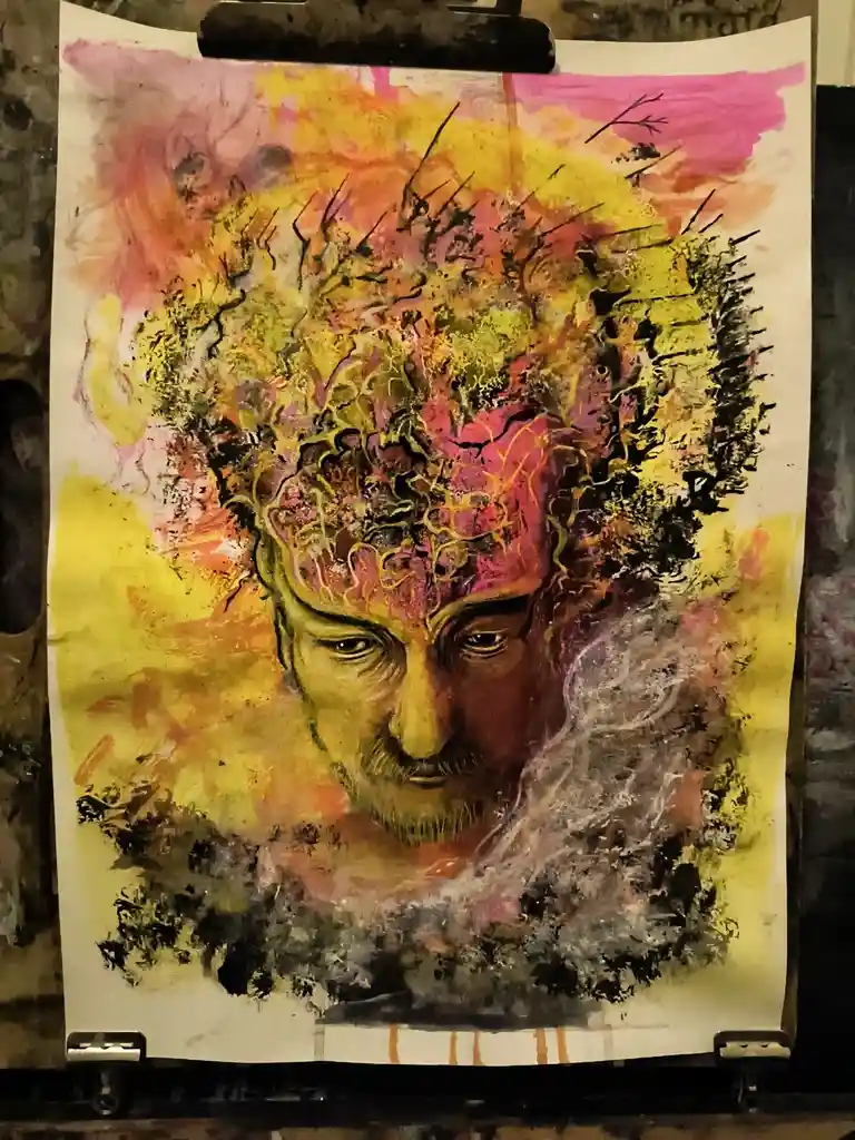 A watercolor painting of a man's face with a vibrant, abstract, and chaotic explosion of colors and brushstrokes radiating…