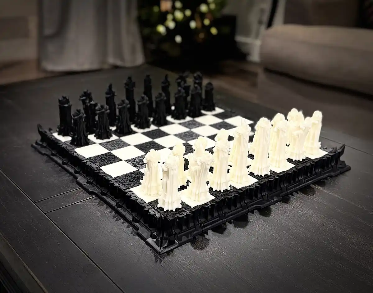 A chess set with black and white pieces arranged on a checkered board, placed on a dark wooden table. The white pieces are…