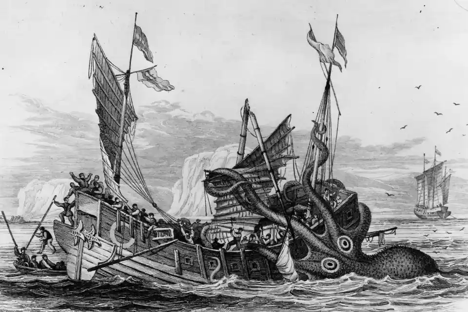 A black-and-white historical engraving depicts a massive kraken attacking a sailing ship, its tentacles缠绕着 the vessel as…
