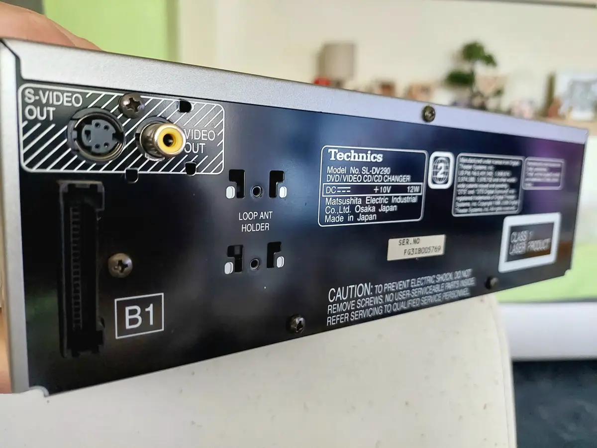 A close-up photo of the back panel of a Technics SL-DV290 DVD/Video CD/CD Changer, showing its ports including S-Video and…