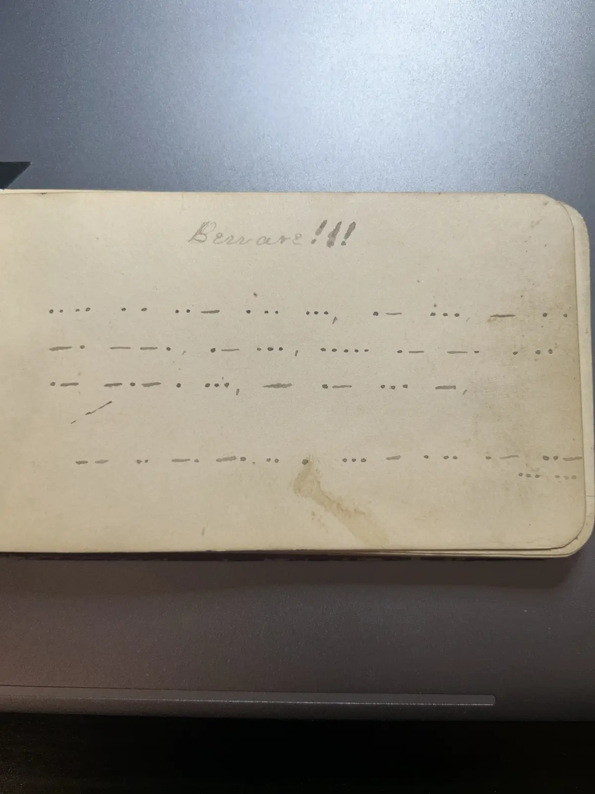 A close-up of a yellowed, aged piece of paper with handwritten text at the top reading 'Berrare!!' and below it, multiple…