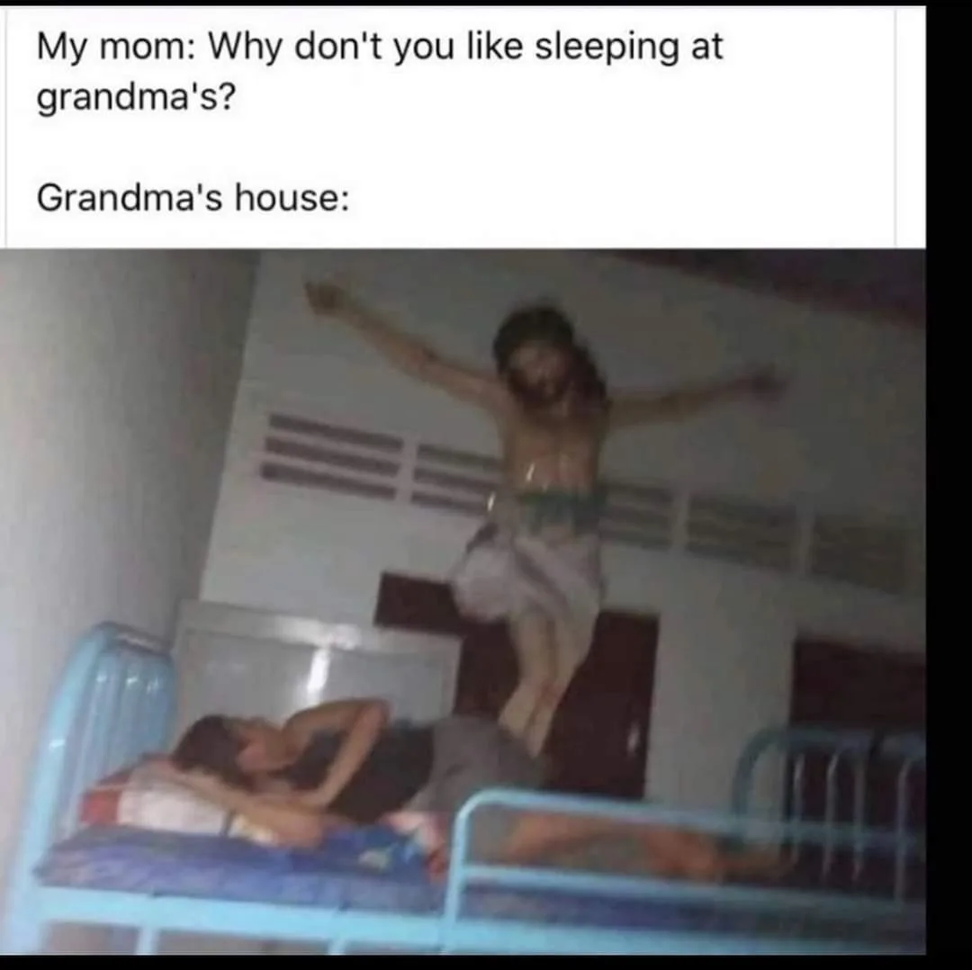 A blurry photo shows a person lying on a lower bunk bed while another person is captured mid-air above them, arms…