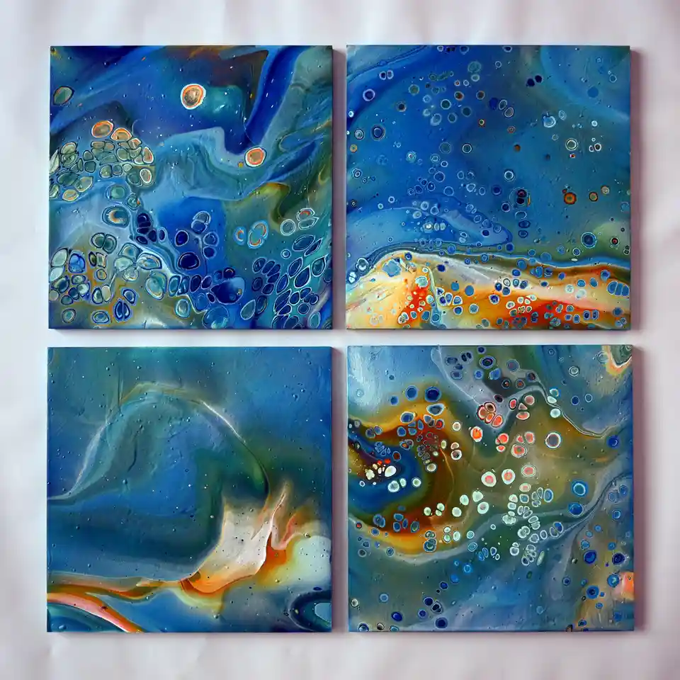Four square abstract paintings with swirling blue, green, and orange colors and numerous circular patterns are displayed in…