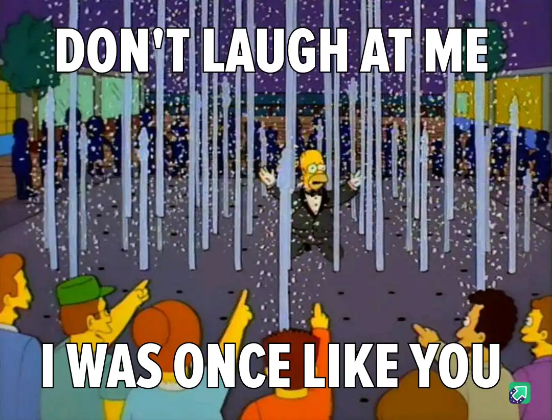 A still from The Simpsons shows Homer Simpson in a tuxedo standing in a fountain of water jets, surrounded by confetti…