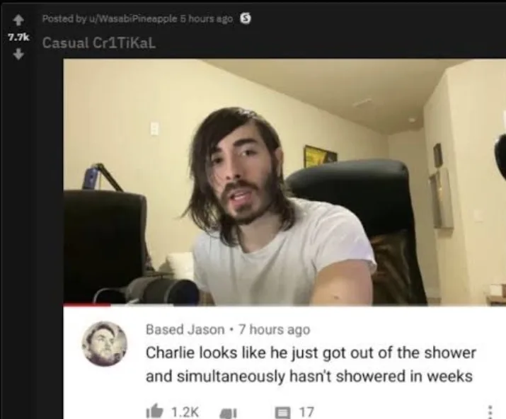 A screenshot of a Reddit comment under a video post, showing a man with long dark hair and a beard wearing a white t-shirt…