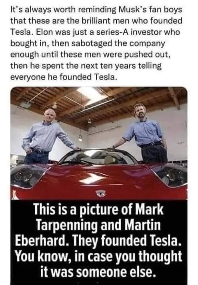 Two men in blue shirts stand on either side of a red Tesla Roadster in a garage. The image has text overlaid at the top and…