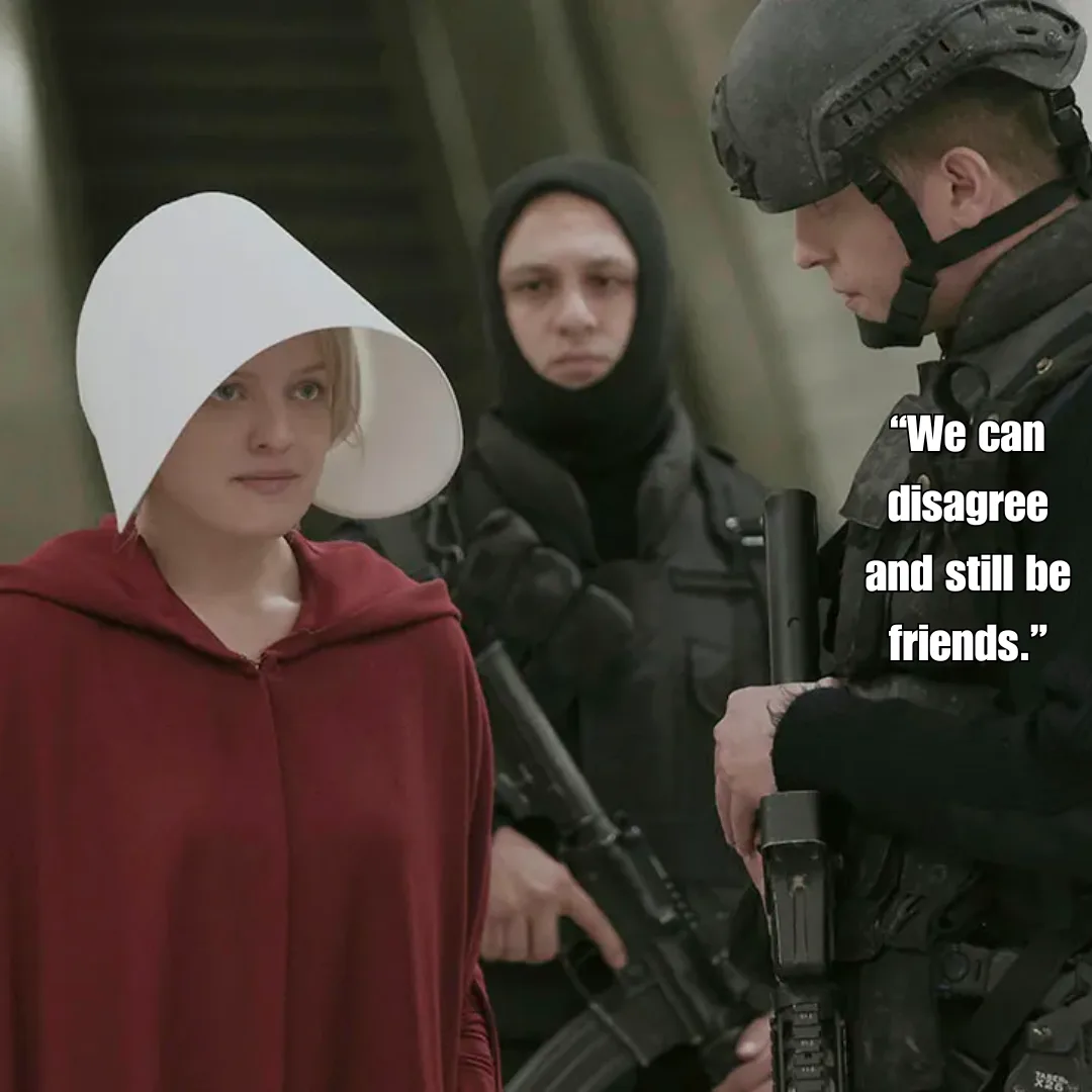 A woman in a red robe and white bonnet stands calmly as two armed men in tactical gear flank her; one points a rifle while…
