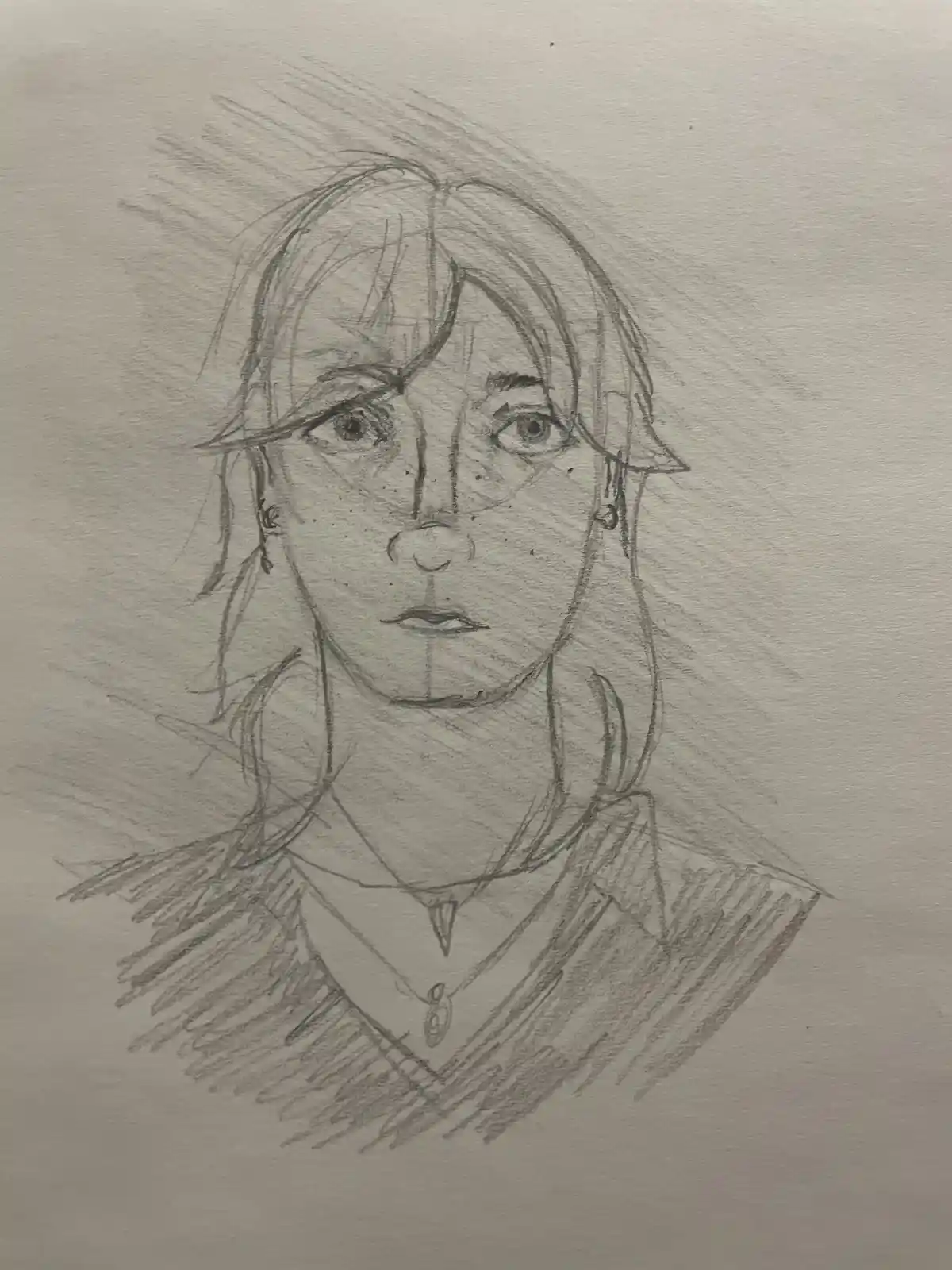 A pencil sketch of a person with shoulder-length hair, earrings, and a necklace, looking directly at the viewer with a…