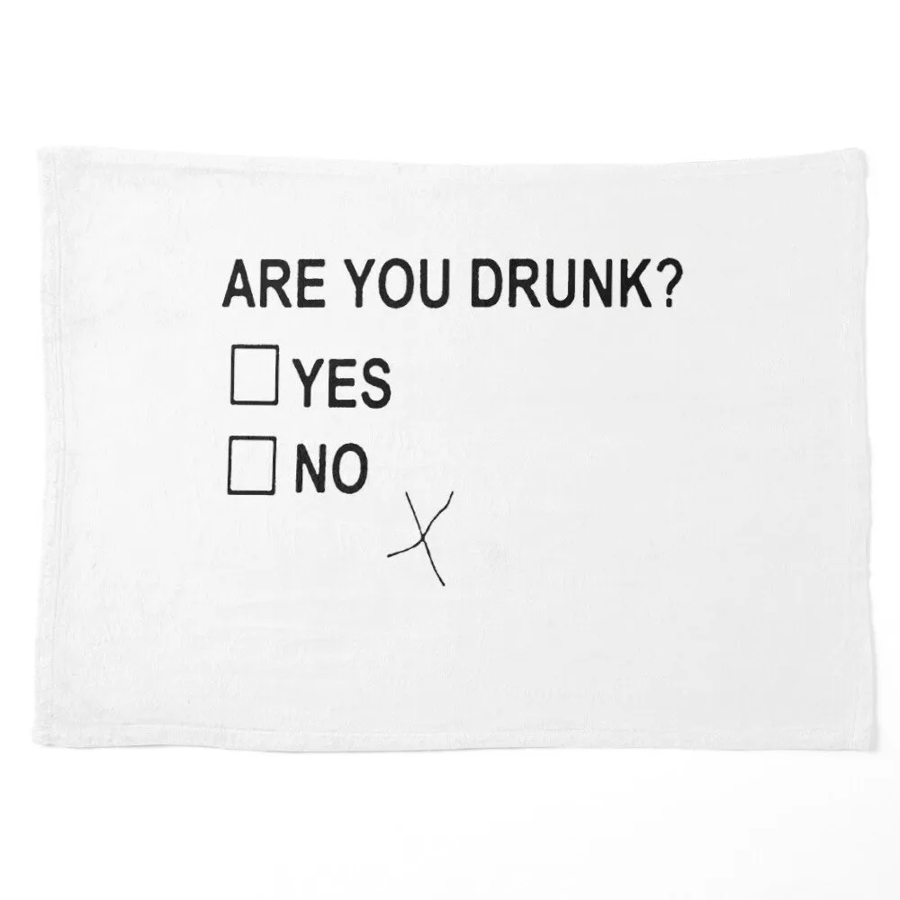 A white towel displays a simple survey question 'ARE YOU DRUNK?' with two checkboxes labeled 'YES' and 'NO'. A handwritten…