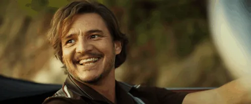 A six-panel image shows actor Orlando Bloom in a car, his expression escalating from a slight smile to a wide, joyful laugh…