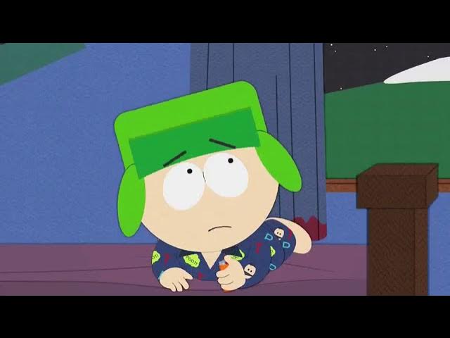 A cartoon boy in green hat and pajamas sits on the floor looking sad while holding a small object. The overlaid text reads…