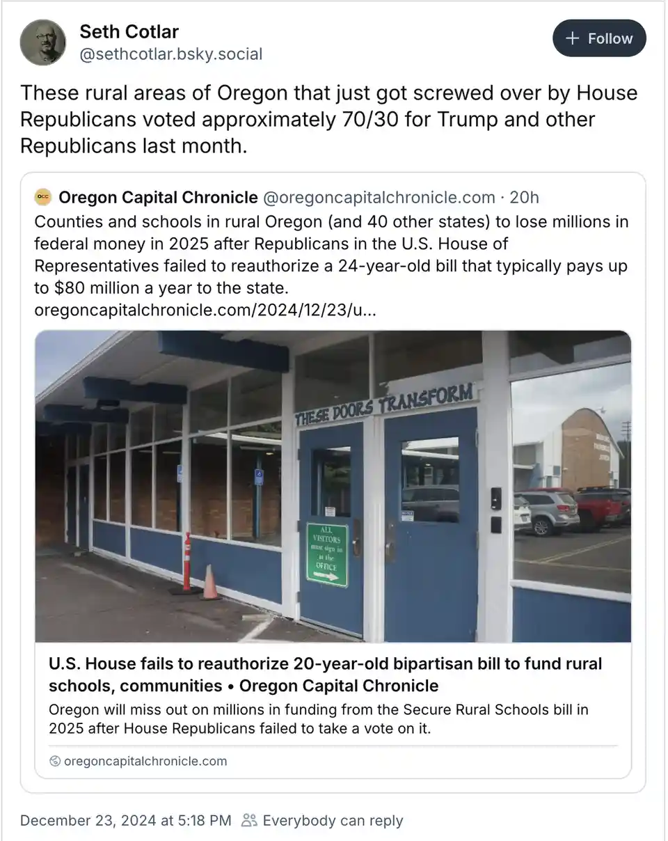 A screenshot of a social media post showing a photo of a school building with blue doors and windows. Above the doors, a…