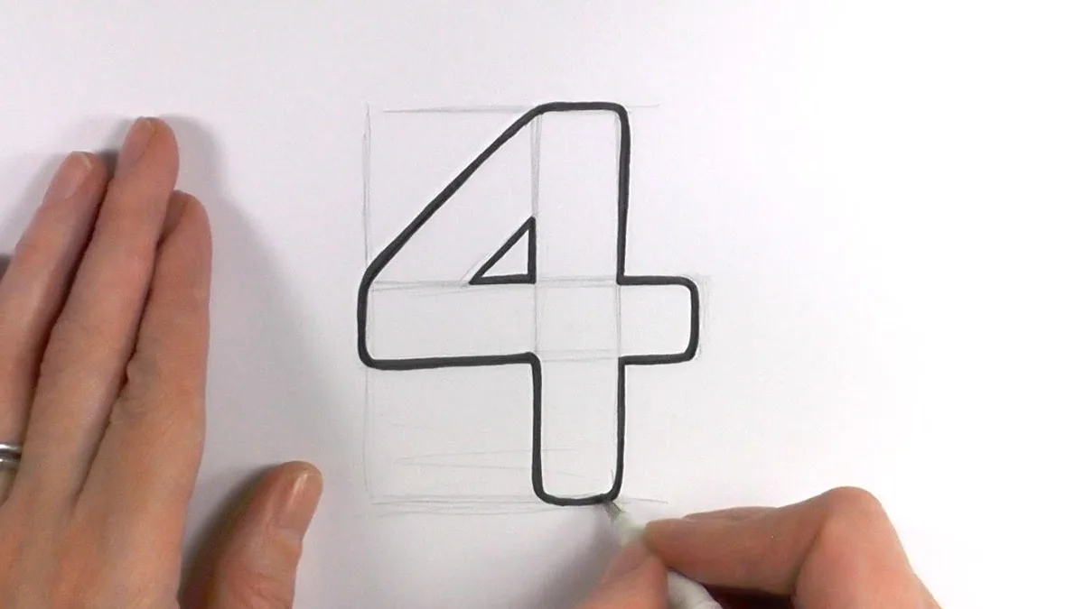 A person's hands are shown drawing the number 4 with a black marker on white paper, using faint pencil grid lines as guides…