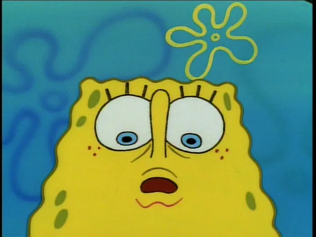 a close-up of the cartoon character spongebob squarepants with a shocked, wide-eyed expression, his mouth slightly open in…