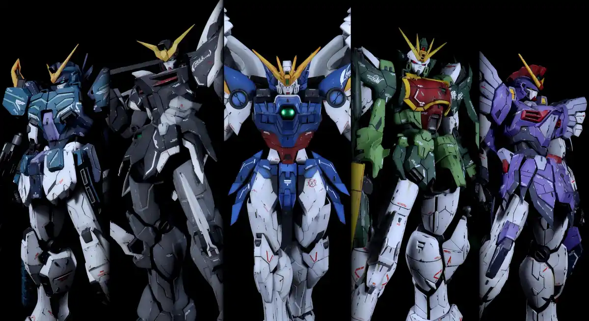 Five distinct Gundam-style mecha models are displayed side-by-side against a black background, each with unique color…
