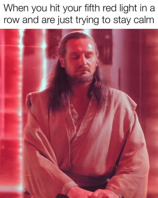 A man with long hair and a beard, wearing a loose robe, sits with his eyes closed and a calm, resigned expression. The image…