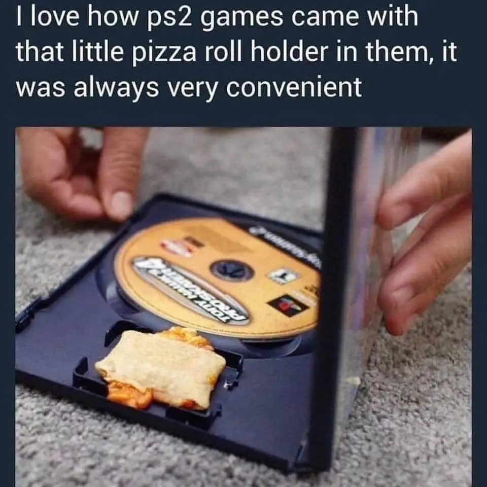 A person holds open a PlayStation 2 game case, revealing a pizza roll nestled in the tray's built-in holder, with the game…