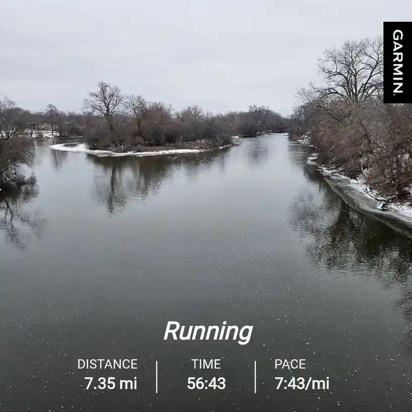 A screenshot from a Garmin fitness tracker showing a running workout with stats: 7.35 miles distance, 56 minutes 43 seconds…