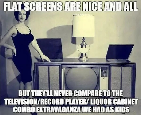 A vintage black-and-white photo shows a woman in a 1950s-style dress standing beside a large, retro television set. On top…