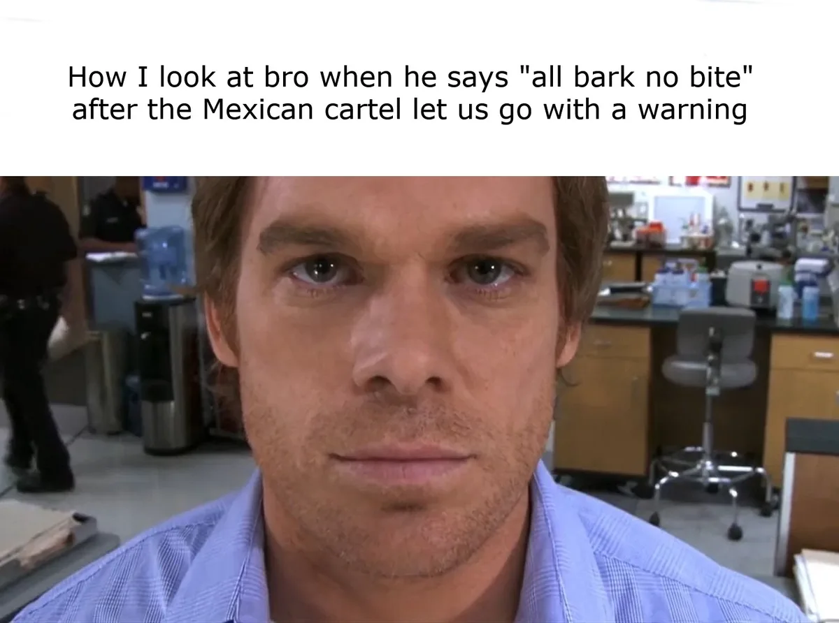 A close-up of a man with a serious, deadpan expression in what appears to be a lab or office setting. The overlaid text…