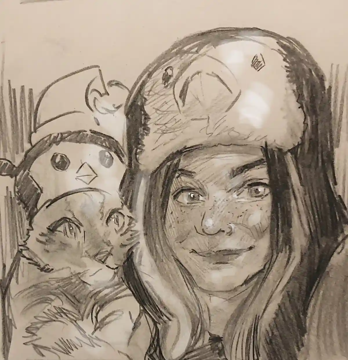 A pencil sketch shows a woman with freckles and long hair smiling while wearing a furry winter hat. Beside her is a smaller…