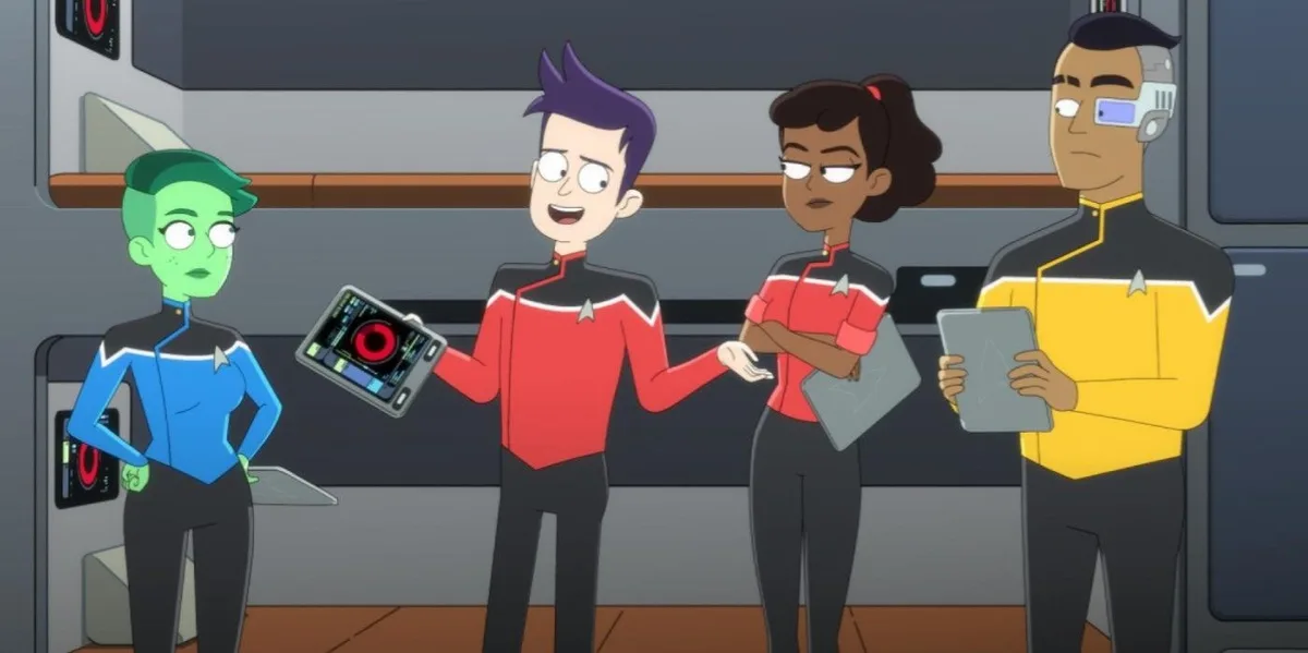 Four animated Starfleet crew members stand in a ship's corridor. The central character, in a red uniform, holds up a tablet…