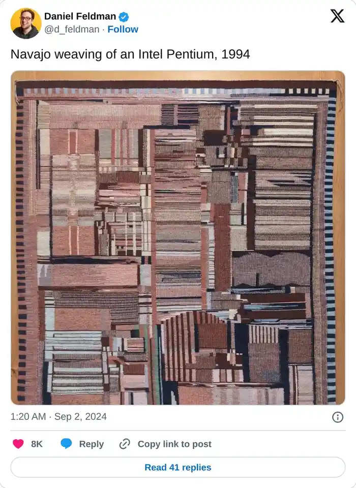 A close-up photo of a Navajo weaving, dated 1994, with a complex geometric pattern in earthy tones of brown, beige, and…
