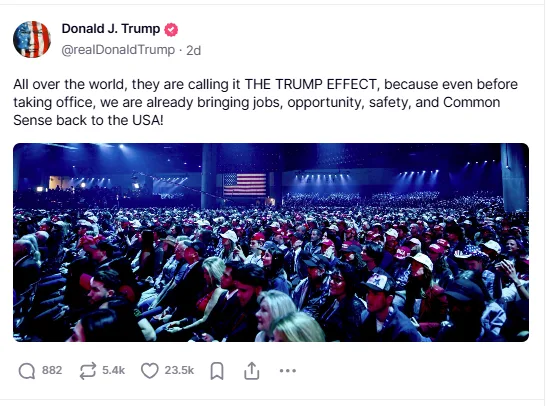 A screenshot of a tweet from Donald J. Trump's account showing a large crowd at an event with an American flag visible. The…