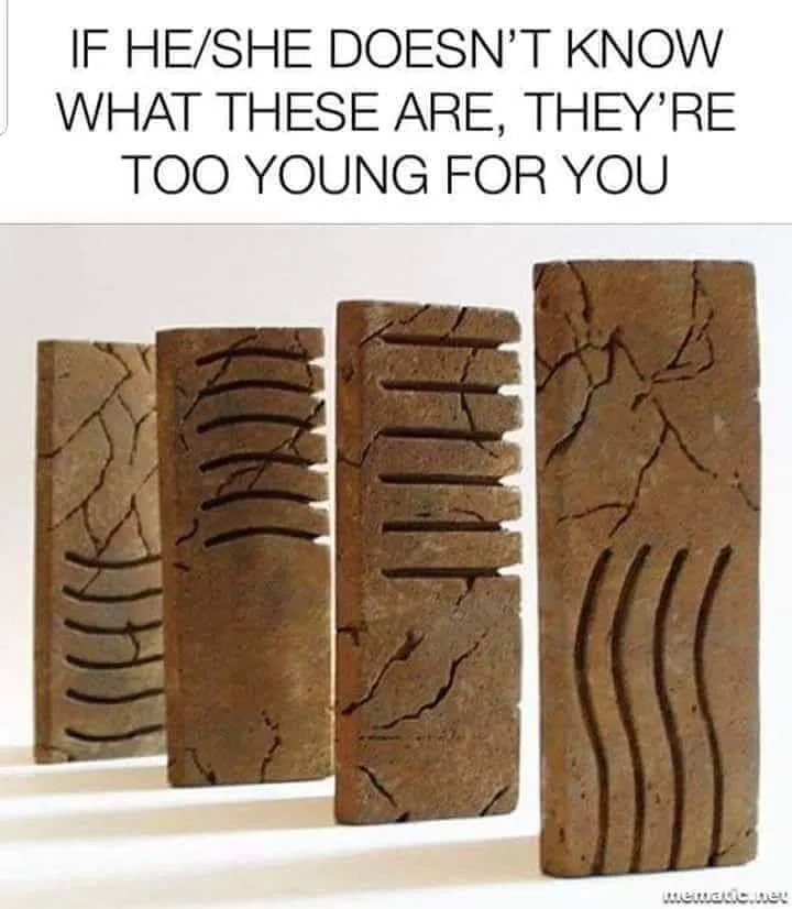 Four rectangular clay tablets with ancient cuneiform script etched into them are arranged in a row against a plain white…