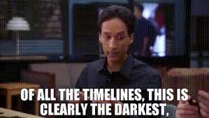 A man with dark hair and a black shirt stares with a shocked, wide-eyed expression. White bold text overlaid on the image…
