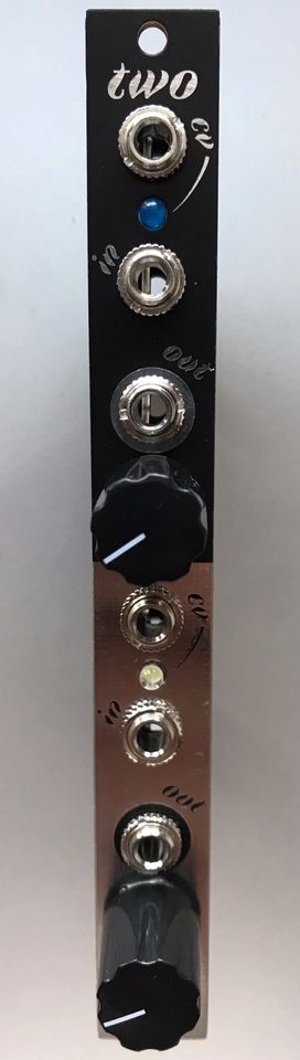 A vertical black and copper-colored modular synthesizer module with two large black knobs, multiple silver jacks labeled…