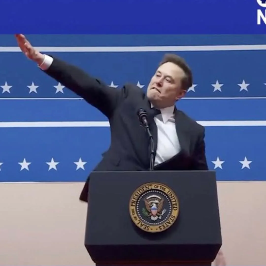 A man in a dark suit and white shirt stands at a podium bearing the Seal of the President of the United States, gesturing…