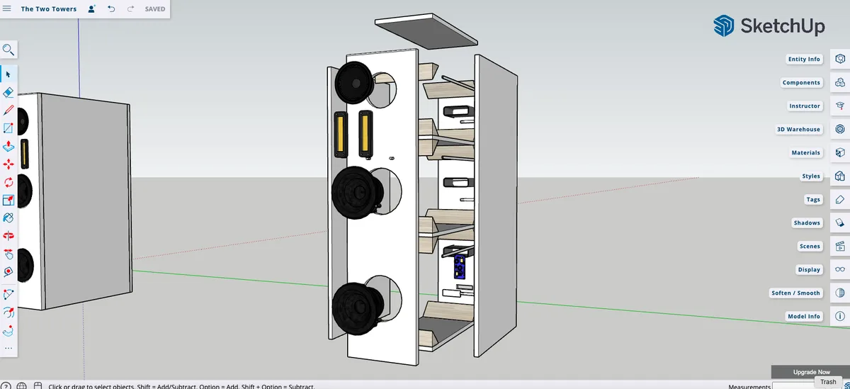 A screenshot from the SketchUp 3D modeling software shows two tall, white, rectangular objects resembling towers. The tower…