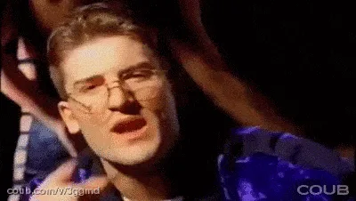 A split-screen image shows a man in glasses and a blue jacket in various poses, including pointing at the viewer and looking…