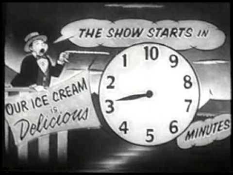 A vintage black-and-white cartoon shows a man in a bowler hat shouting from behind a sign that reads 'OUR ICE CREAM IS…