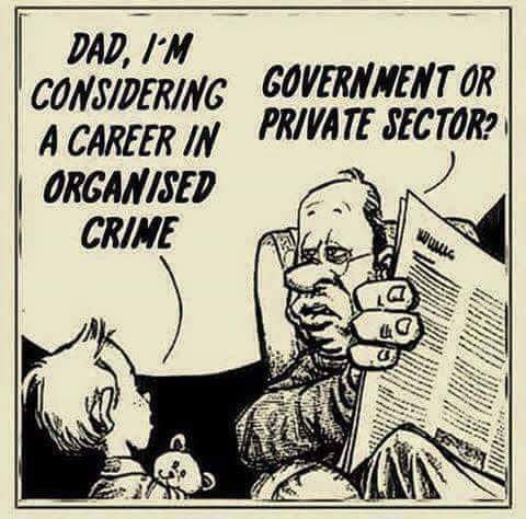 A black-and-white cartoon depicts a young child speaking to an older man, presumably his father, who is seated and reading a…