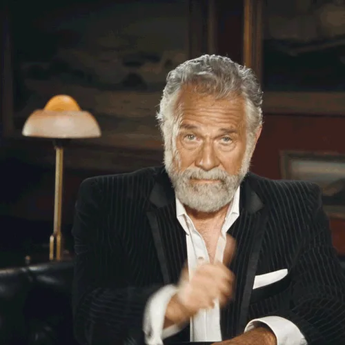 A six-panel grid shows Mel Gibson seated at a desk in a dark pinstripe suit over a white shirt, giving a thumbs-up gesture…