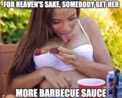 A woman in a white top is sitting outdoors, licking barbecue sauce off a piece of meat she's holding. She has long brown…