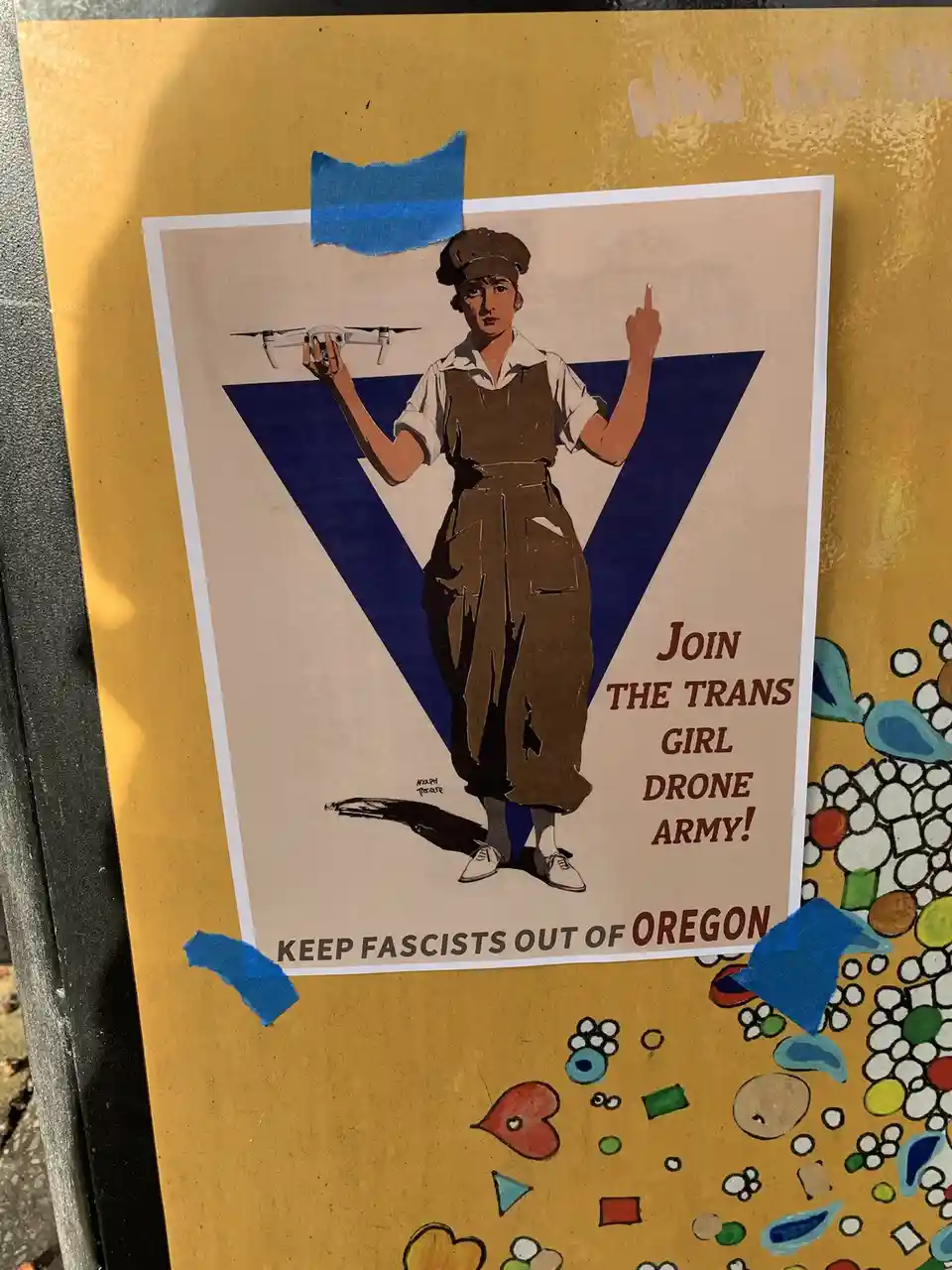 A vintage-style propaganda poster features a woman in overalls and a cap, holding a modern drone in one hand and pointing…