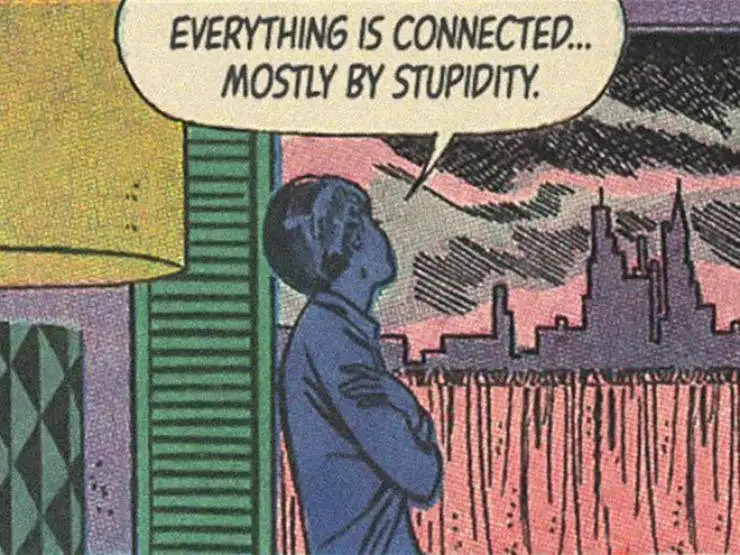 A comic book panel shows a blue-skinned man in a blue shirt standing with arms crossed, looking out at a city skyline at…