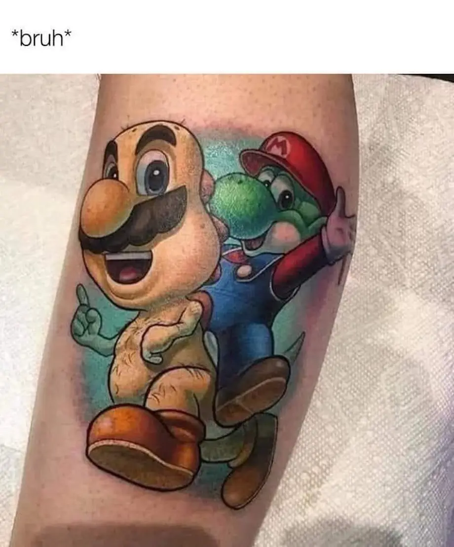 A tattoo on a person's arm depicts the video game character Mario riding Yoshi, who is in turn riding a large, bald…