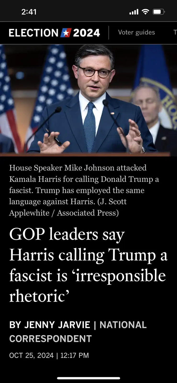 A screenshot of a news article from a phone displaying a photo of House Speaker Mike Johnson speaking at a podium with…