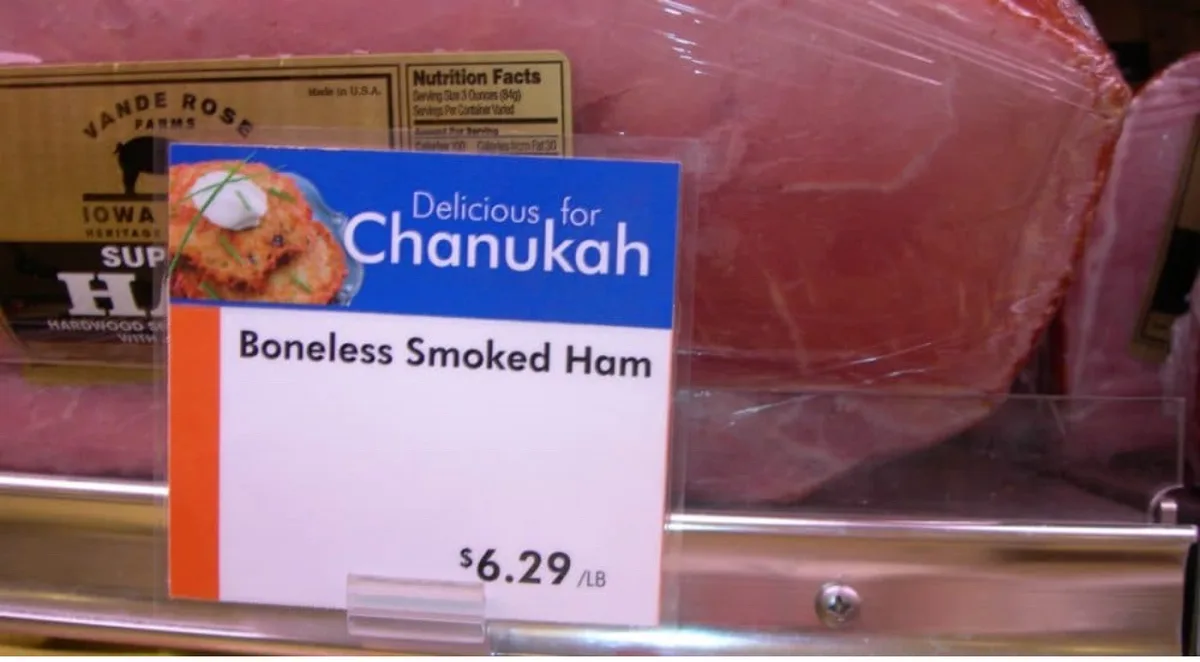 A grocery store meat display shows a boneless smoked ham with a price tag of $6.29 per pound. The product label features a…