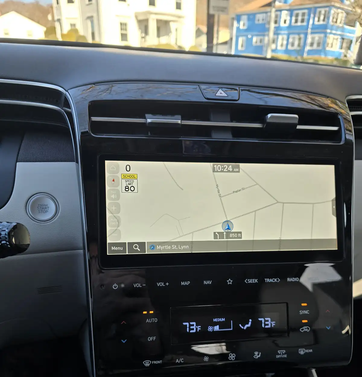 A car's navigation screen shows a map with a 'SCHOOL' warning and a speed limit of 80, while the overlaid text reads 'school…