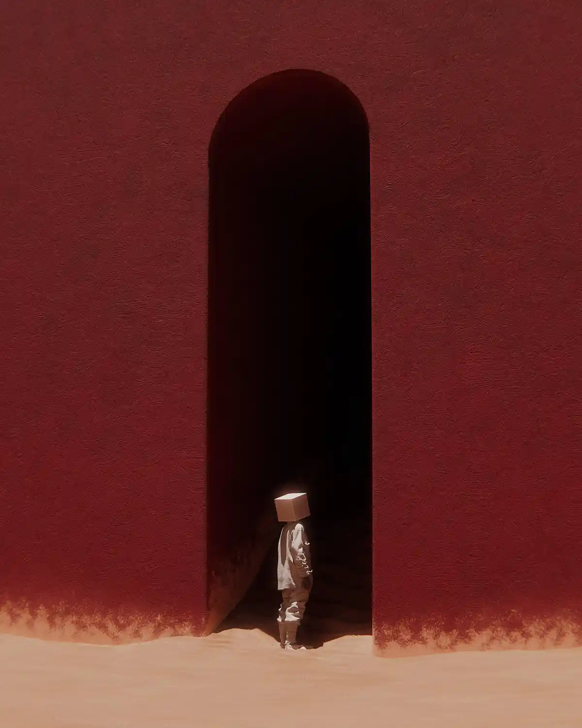 A person wearing a white, box-shaped head covering stands at the threshold of a dark, arched doorway set into a textured…