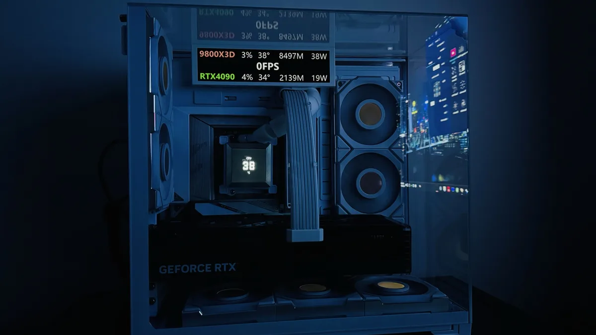 A computer case with a transparent side panel shows internal components under blue lighting, including a CPU cooler…