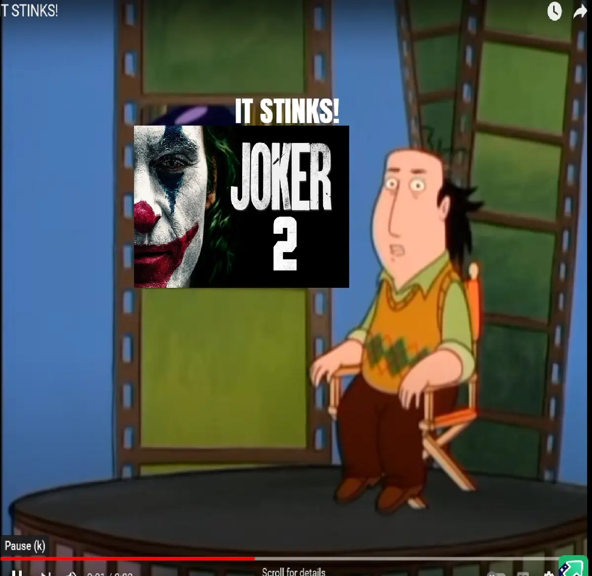 A cartoon man sits in a director's chair looking shocked as a movie poster for 'Joker 2' appears on screen behind him, with…