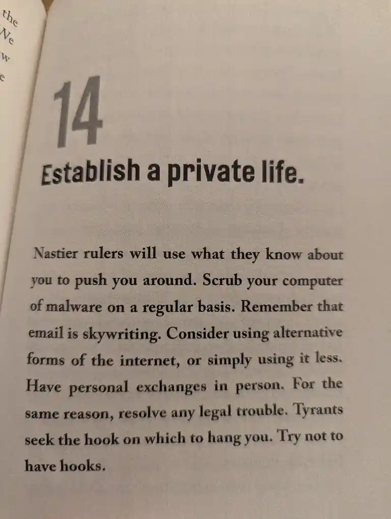 A close-up photo of a book page showing section 14 titled 'Establish a private life.' The text advises readers to scrub…