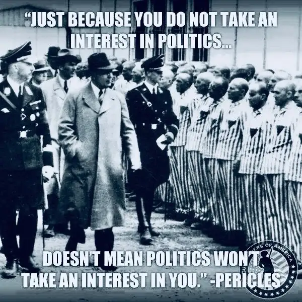 A black-and-white historical photograph shows a man in a long coat walking past a line of men in striped prison uniforms…